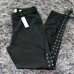 New York & Co Black Leggings w/ peek a boo tie along legs.  Large new w/ tags.